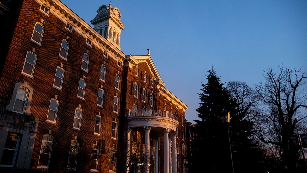 Front entrance of old main during sunset. 