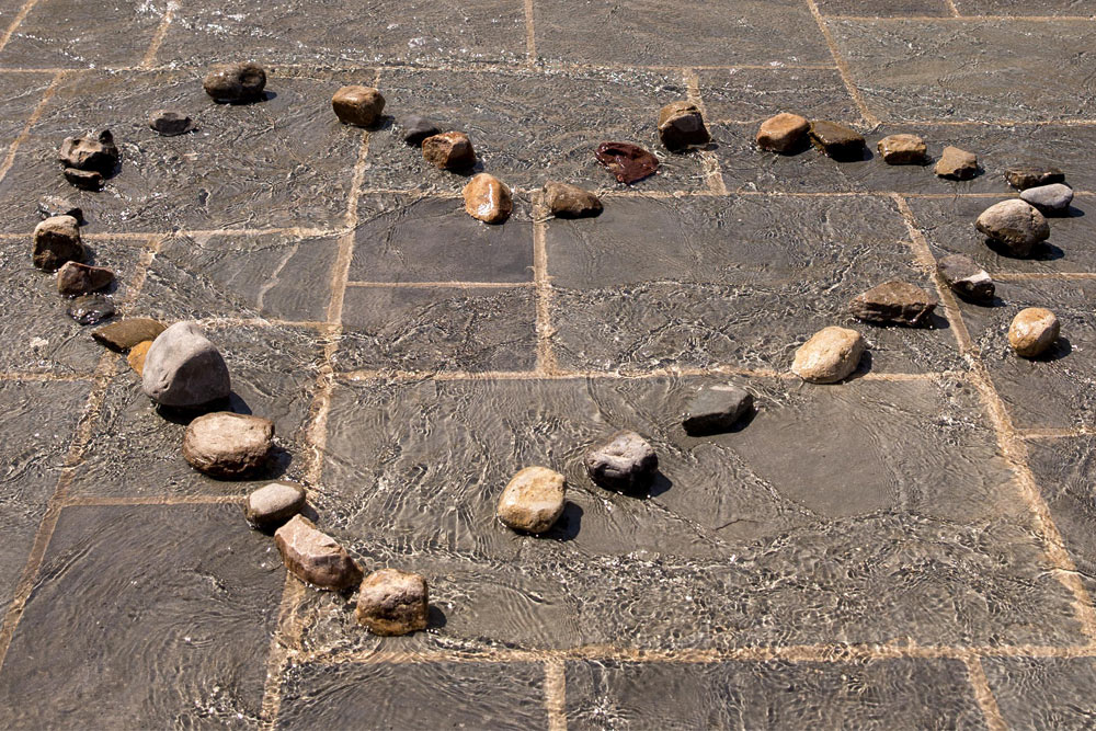 Alumni Plaza with Heart designed in stones of the fountian waters