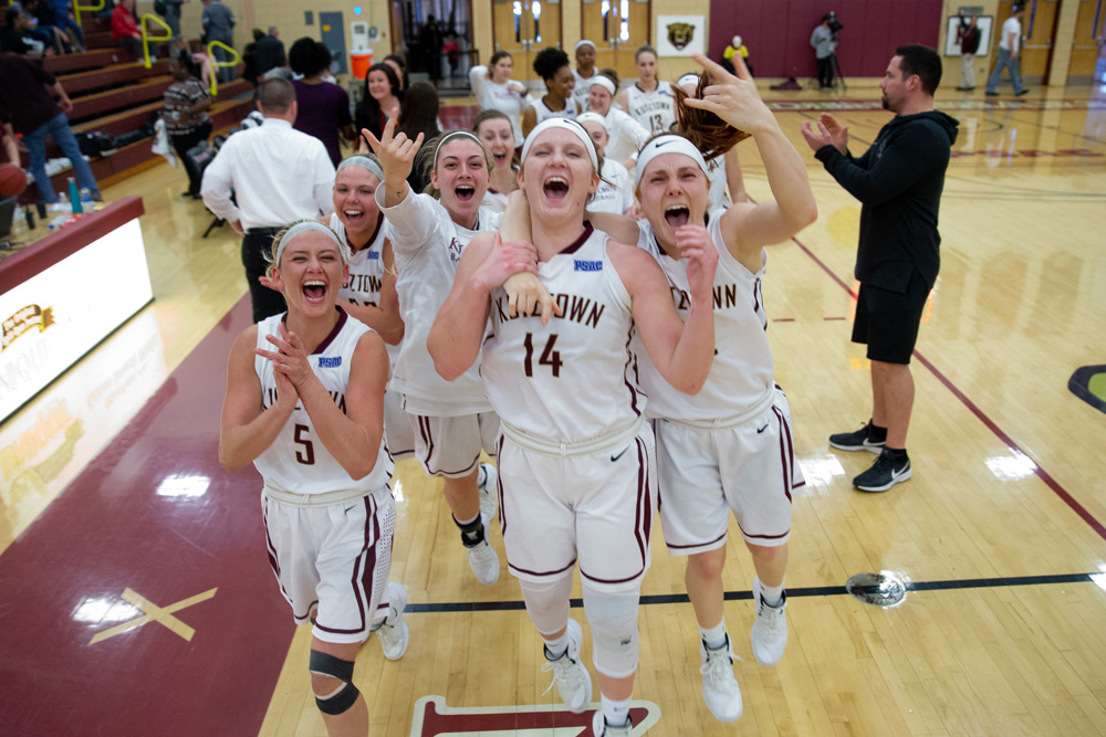 Women's Basketball players celebrate a victory